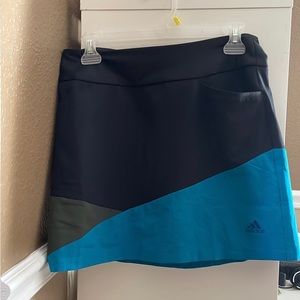 Women’s Adidas athletic skort, black/green/blue, size small. New with tags.